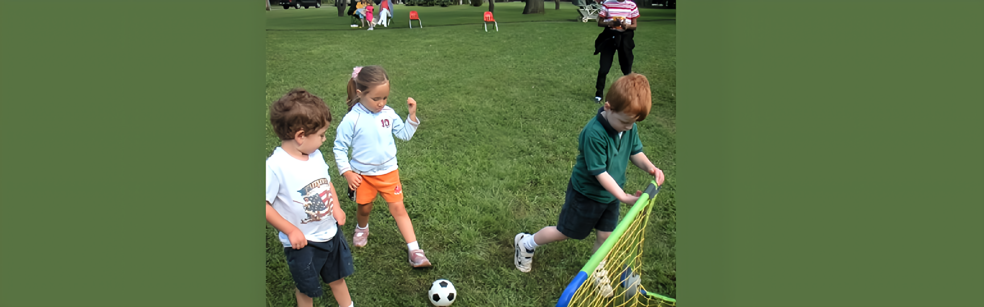 Kids having fun playing soccer on a field